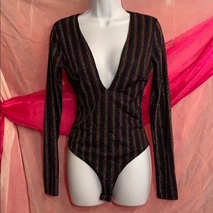 Plunging neckline long sleeve body suit